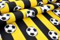 Schwarz-gelb gestreifter Dekostoff mit Fußball-Motiv