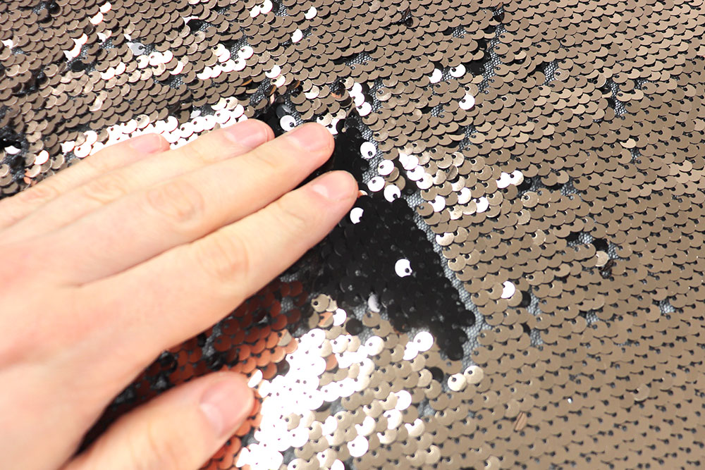 Wende-Pailletten-Stoff - Schwarz/Platin - B-Ware 