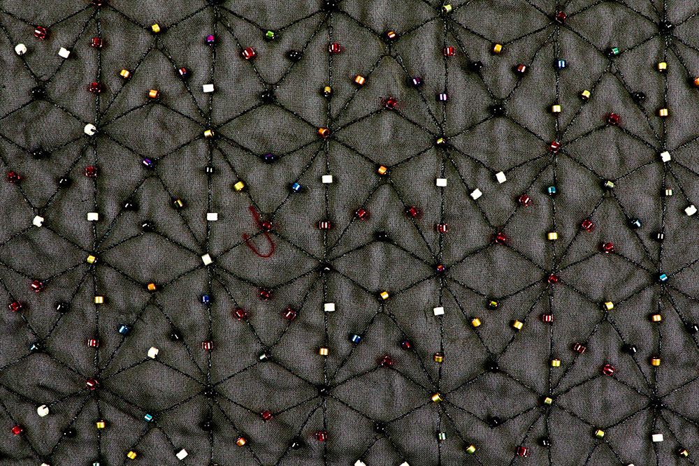 Bekleidungsstoff  - Perlenstickerei